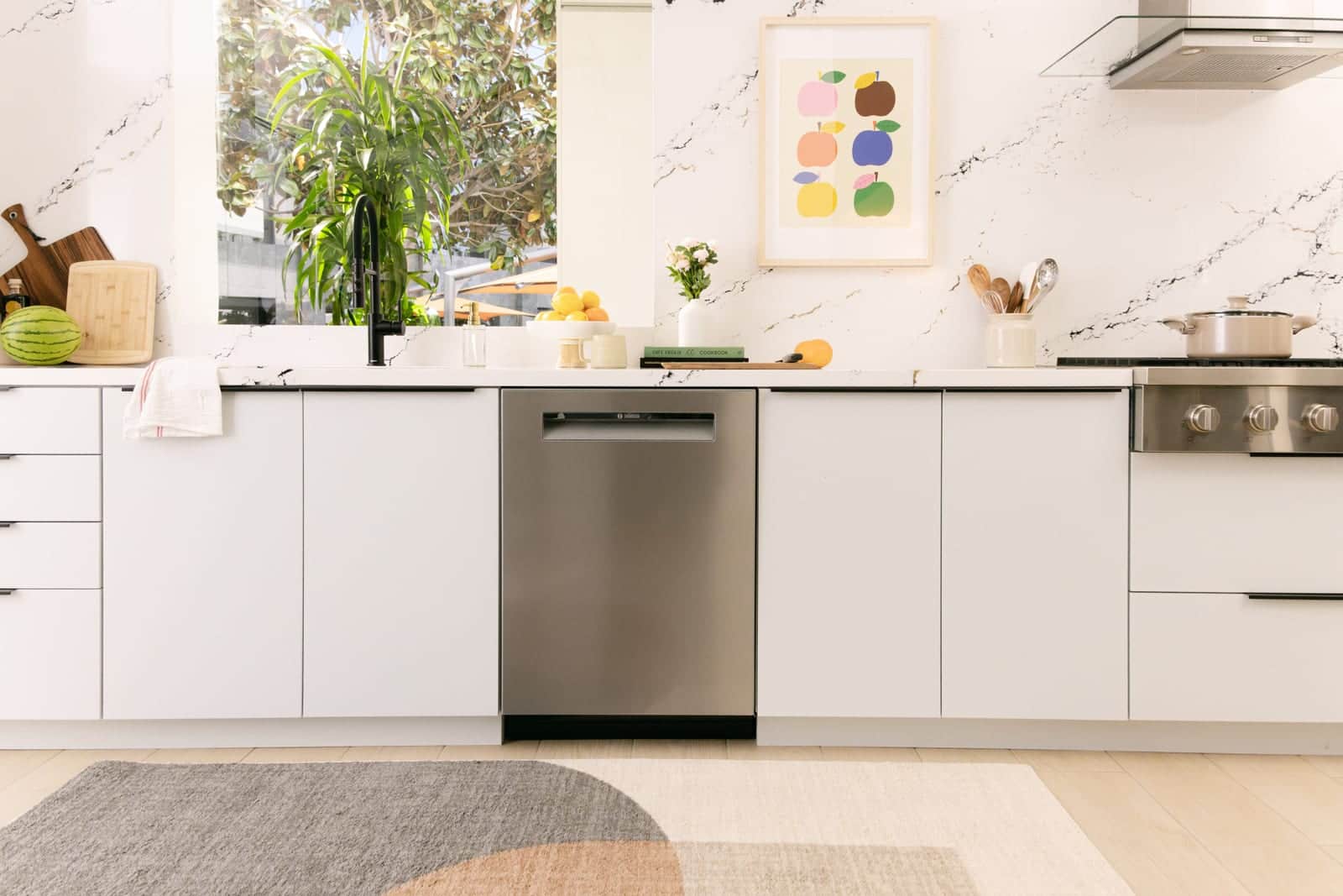 A panel-ready Bosch dishwasher closed flush in a white kitchen