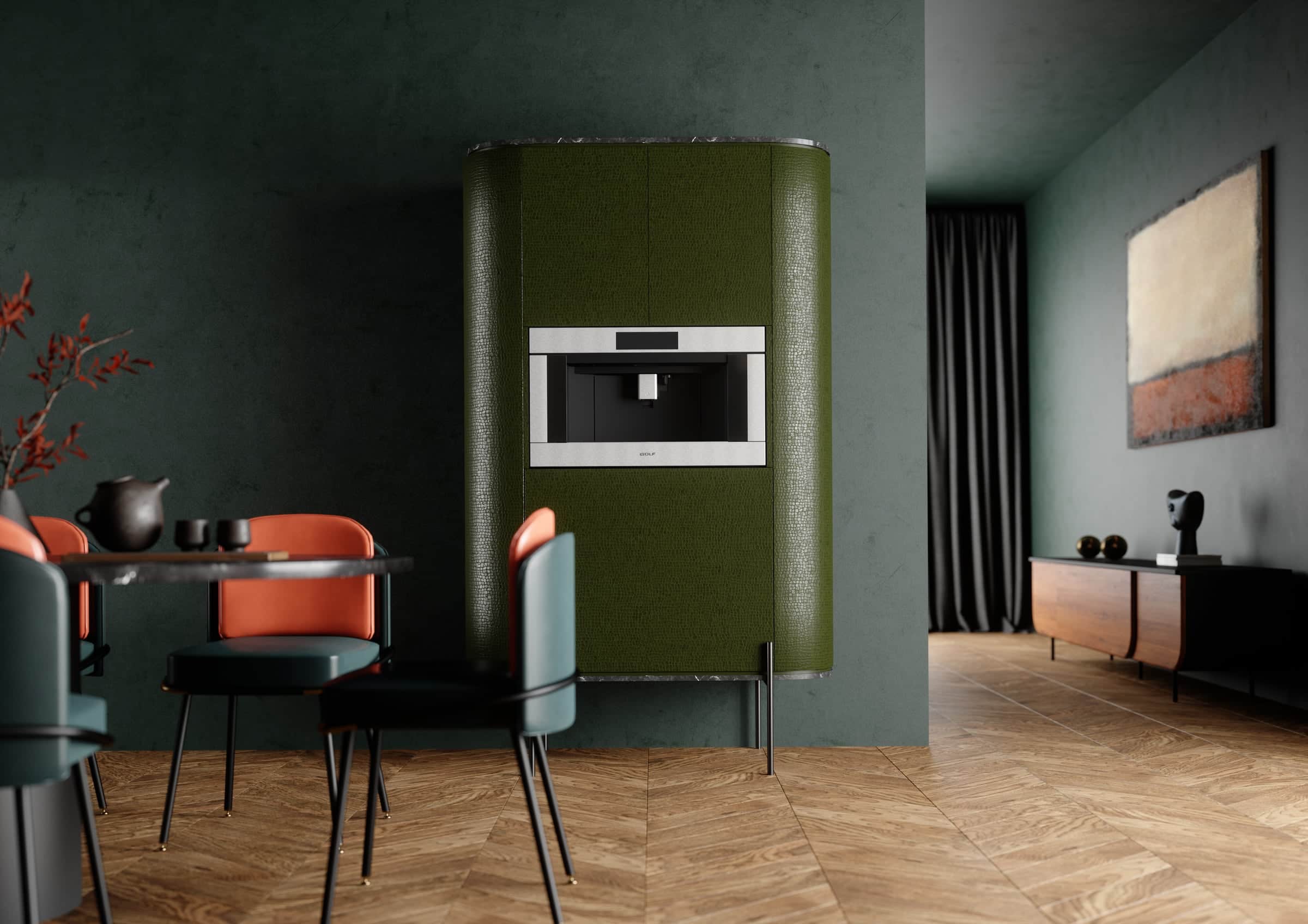 Built-in Wolf coffee system set into an olive green upholstered column in a dark green plaster dining room with orange and teal chairs